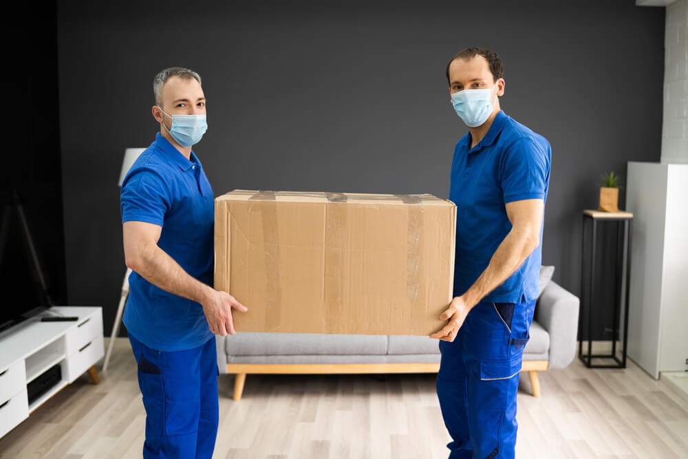 Professional Movers Packing Boxes
